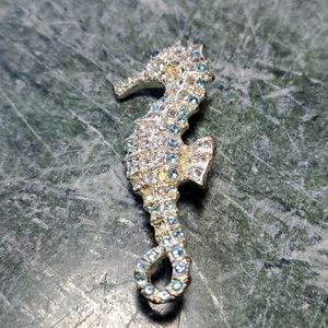 Silvertoned Monet seahorse pin with blue rhinestones